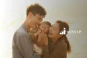 mother, father, and their child on a beach