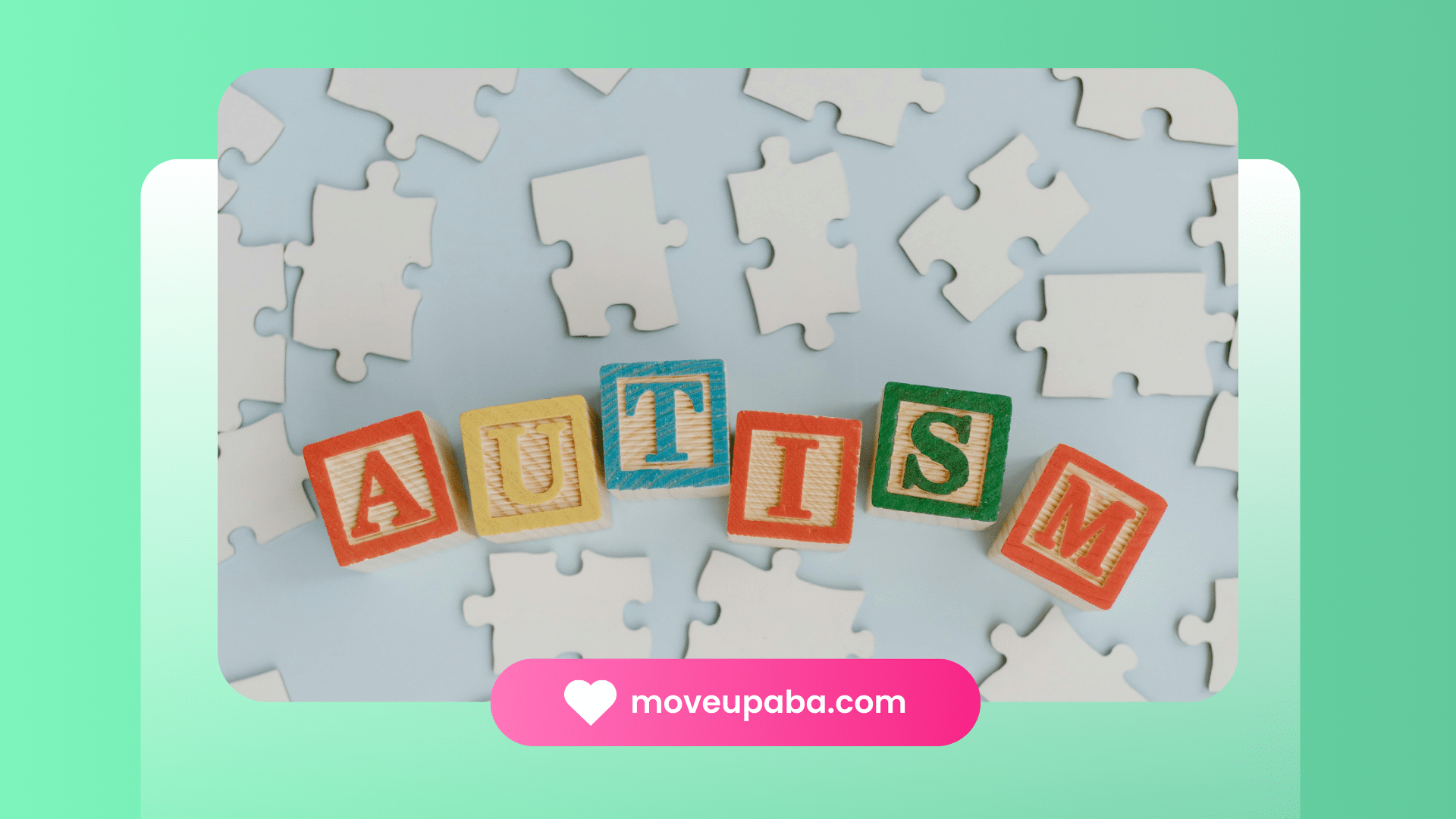 Wooden blocks spelling 'autism' surrounded by puzzle pieces