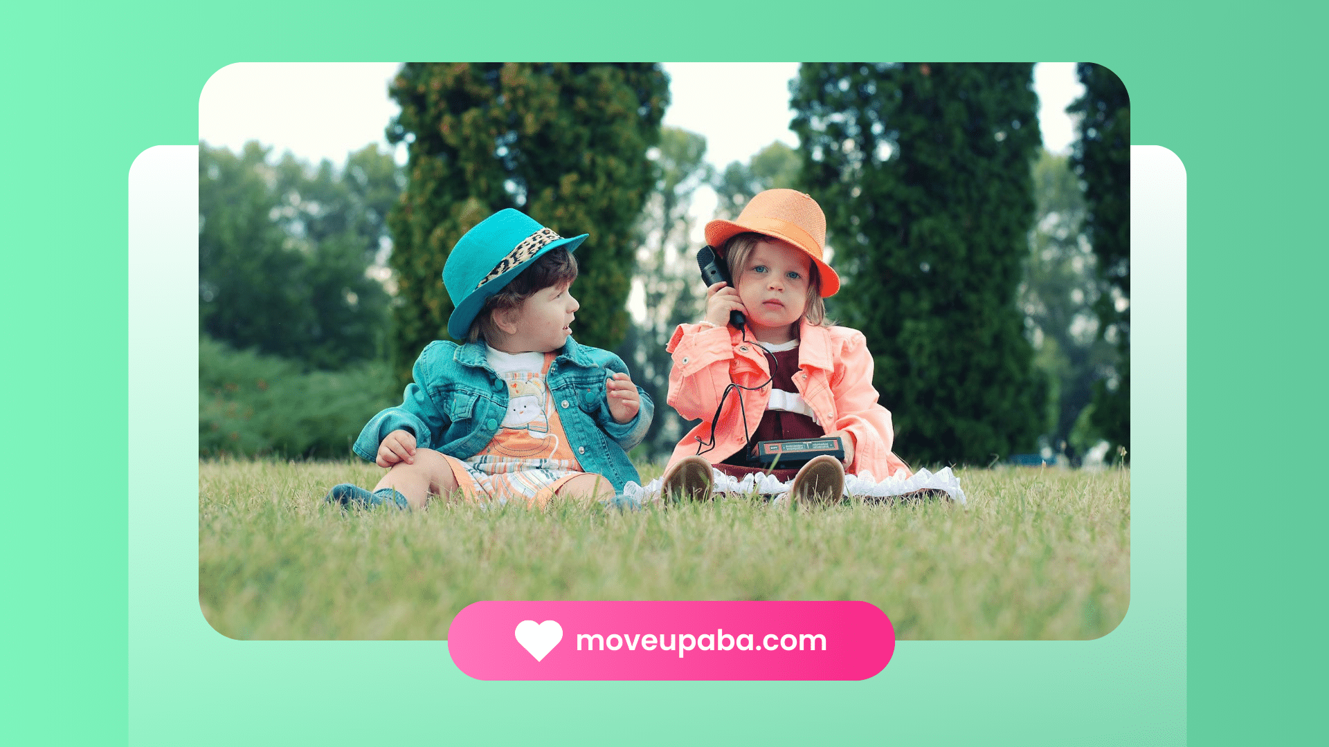 Two autistic toddlers in hats sitting on grass, show the differences between autism and ADHD.