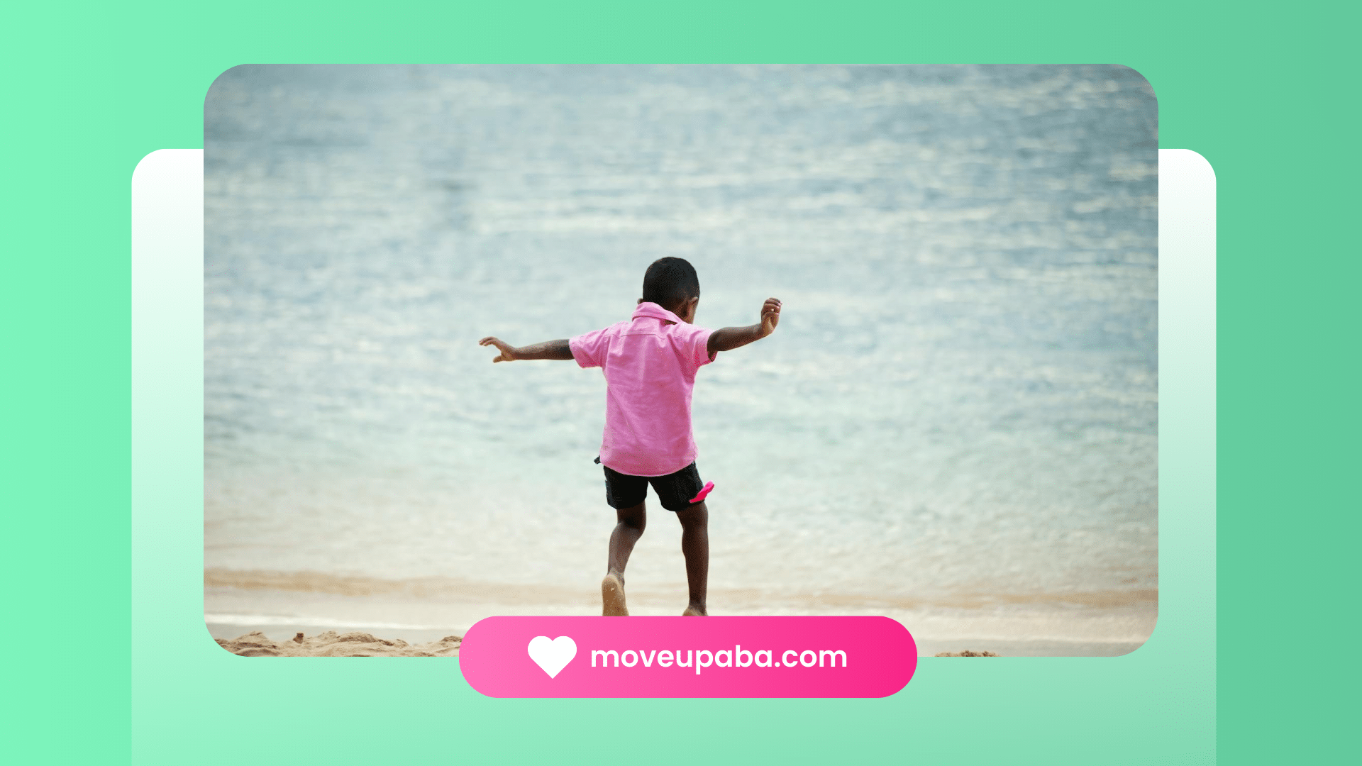 A young boy with autism in a pink shirt joyfully running on a sandy beach by the sea for elopement.