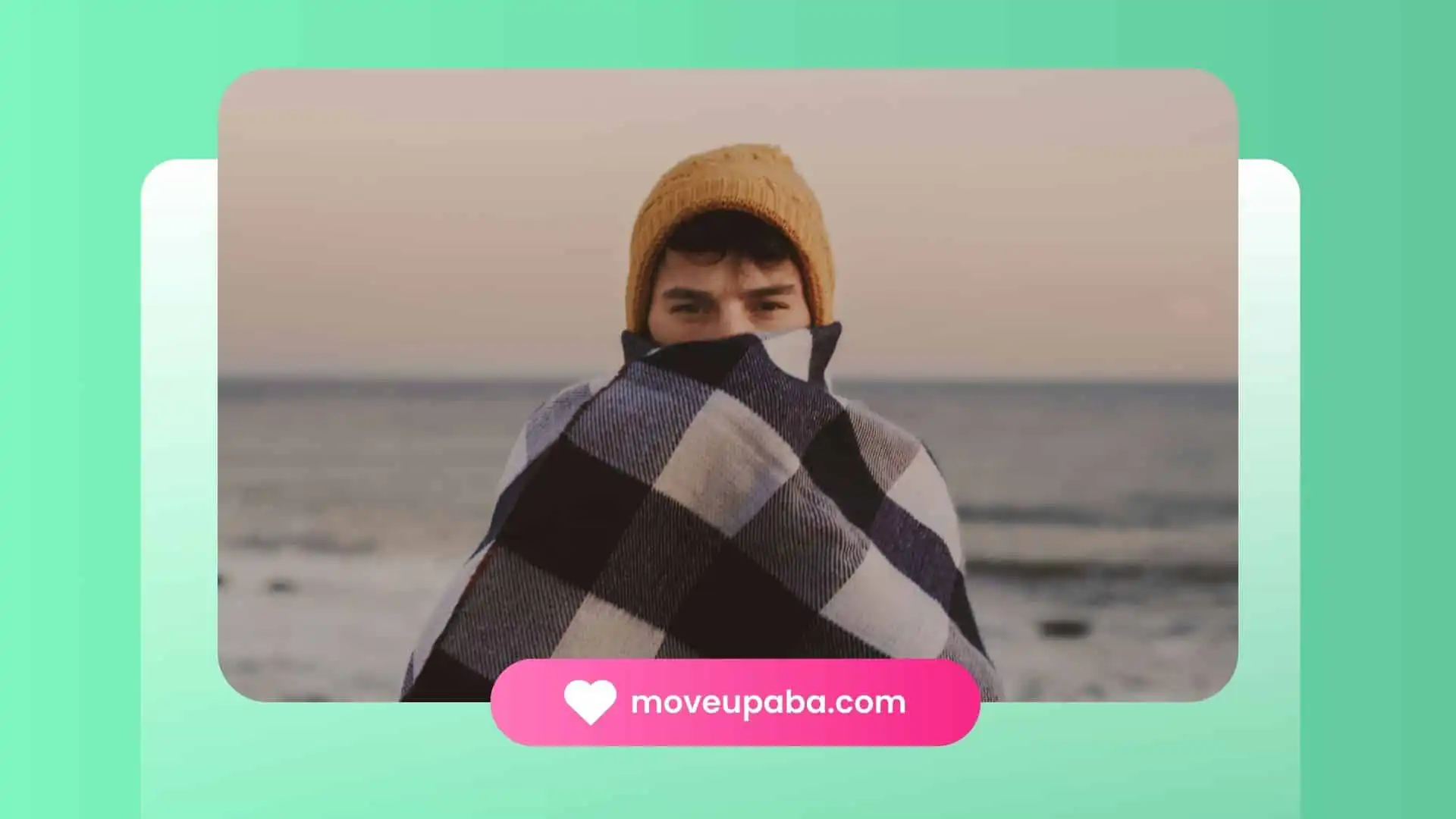 A young boy with autism in a pink shirt joyfully running on a sandy beach by the sea for elopement.