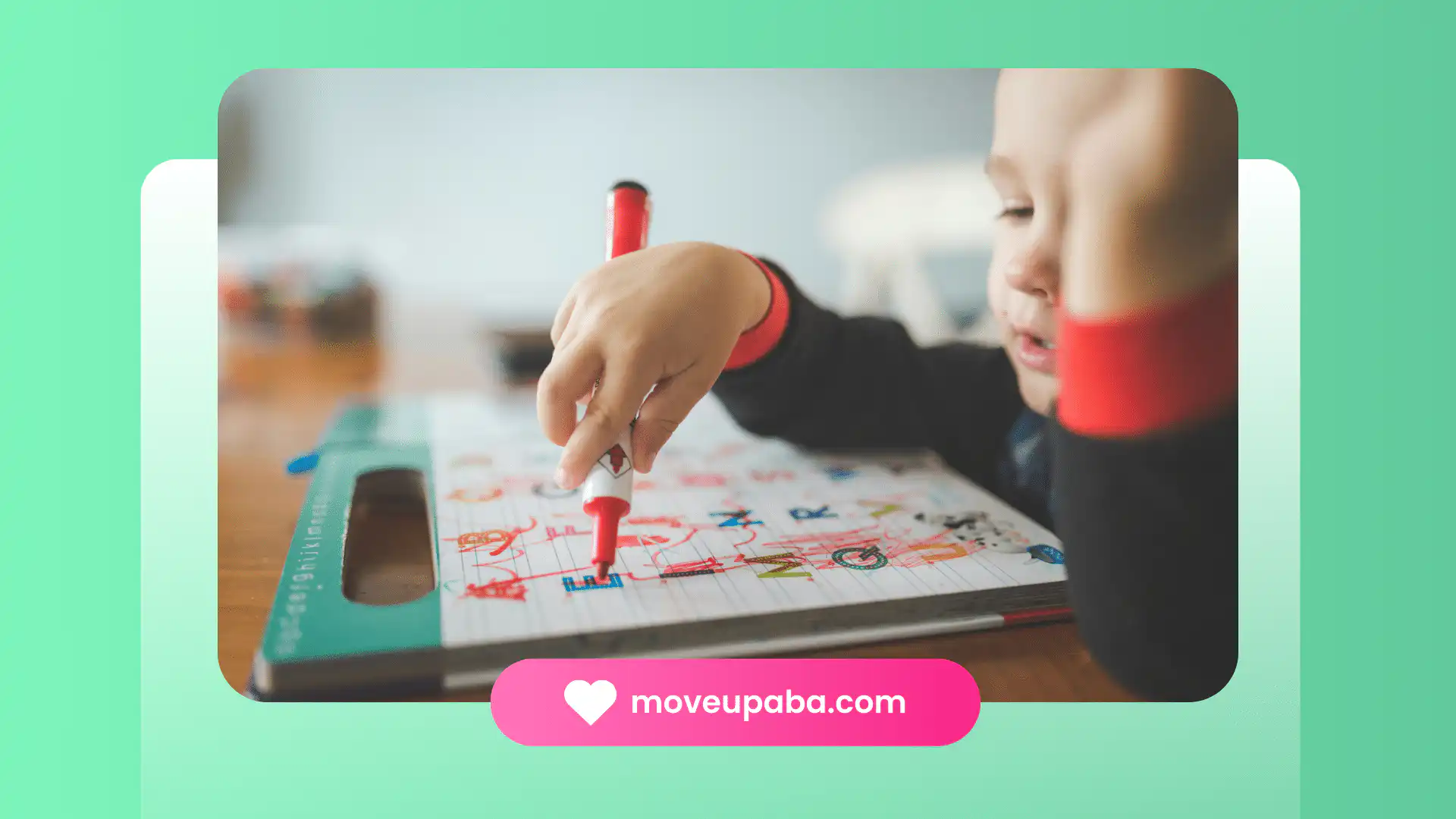 An autistic child drawing with a red marker on a colorful board during an ABA therapy session