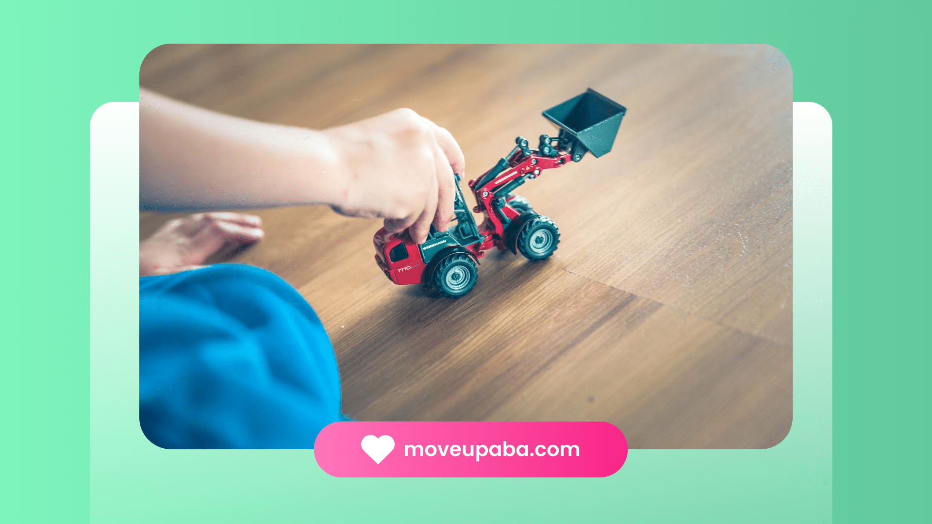 Autistic child playing with a toy tractor on a floor guided by an ABA therapy provider in Maryland.