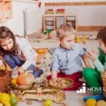 A group of kids playing with pumpkins