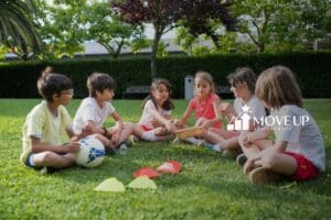 A peer of kids sitting on a park