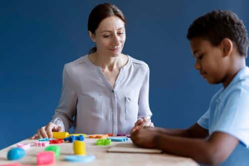 autism support groups in maryland lady teaching a kid