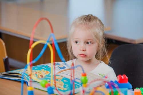 autistic child support with colorful toys