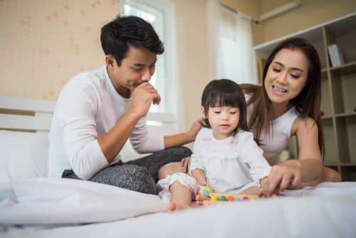 autistic child with parents