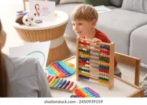 maryland aba therapy providers little boy playing with abacus