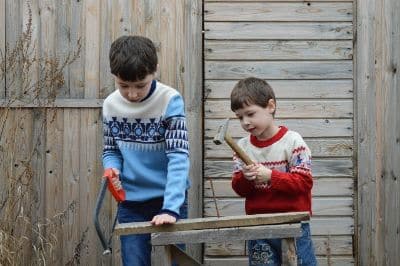 Autism child holding hammer