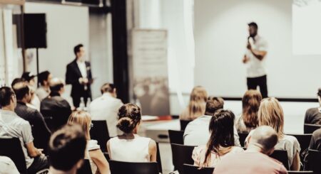 Speaker Giving A Talk about messi has autism