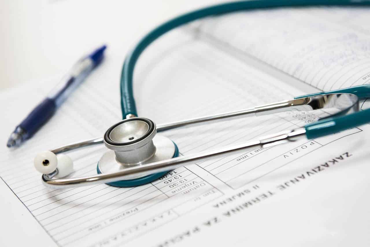 Stethoscope and pen on top of SPD paperwork