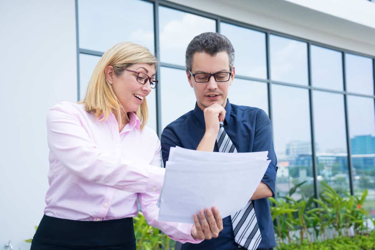 Group of professionals in a relaxed office setting, showing each sign of autism and ADHD in adults.