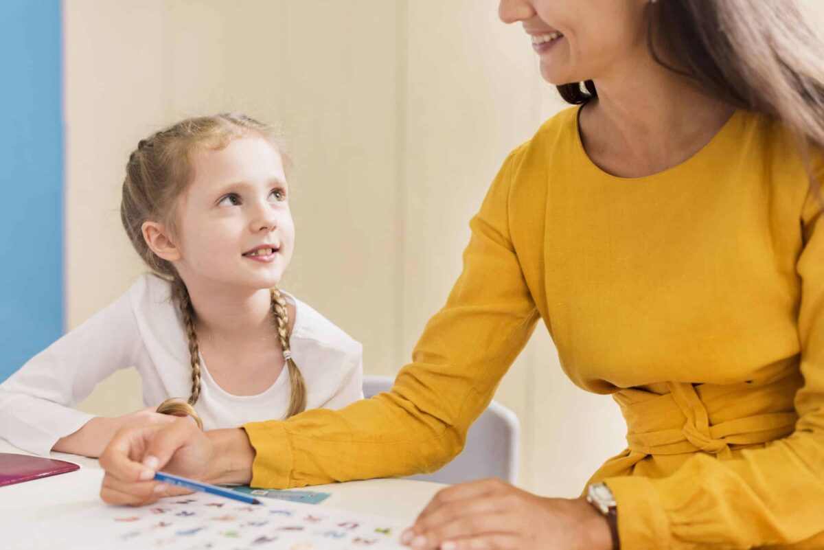 Autistic girl decorating pumpkins as a behavioral therapy, an effective autism and ADHD medication.