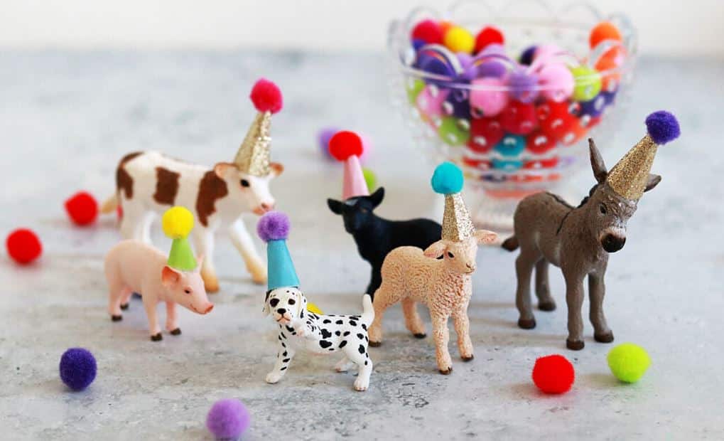 toy animals wearing party hats 