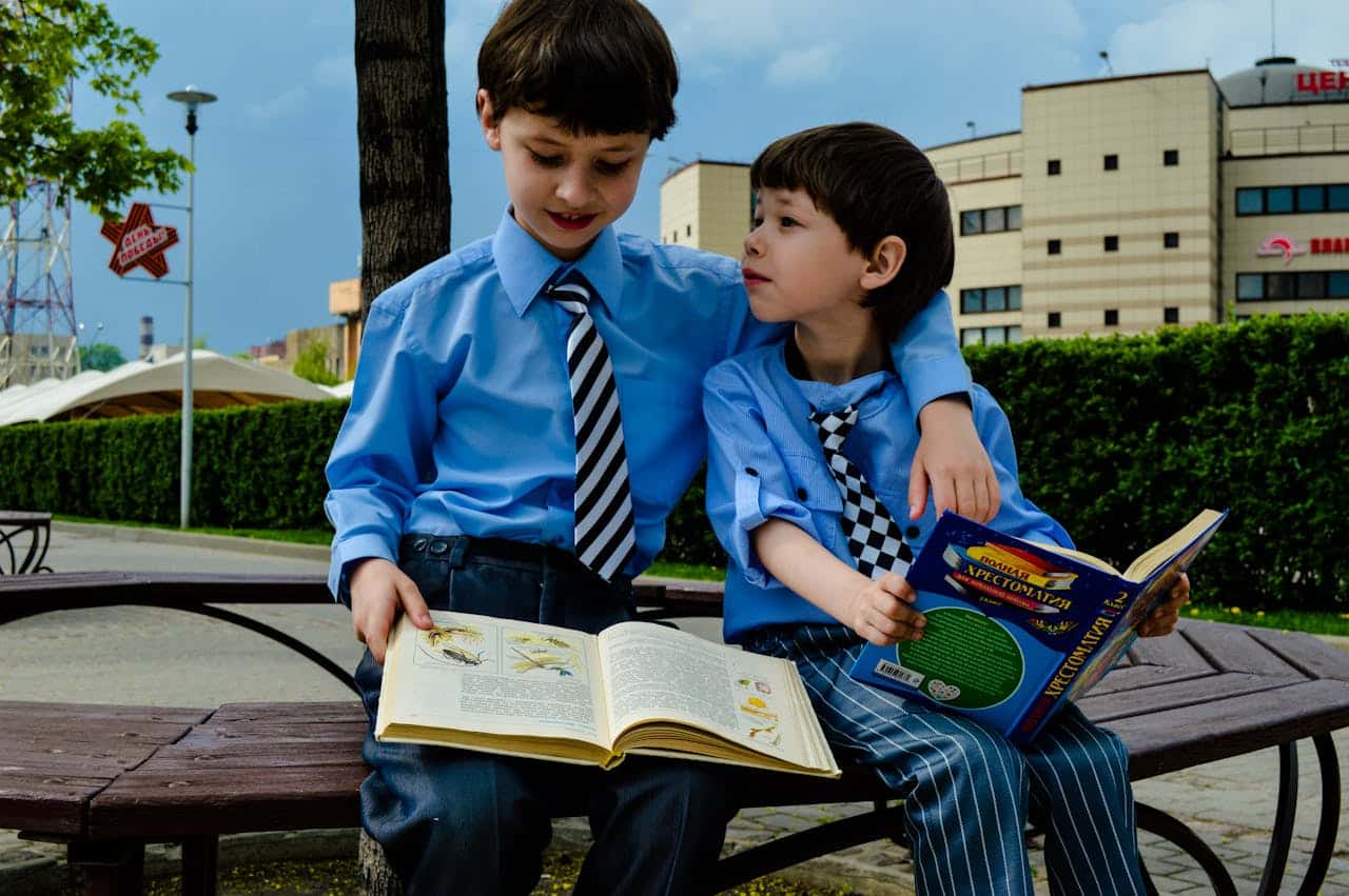 two autistic boys reading books