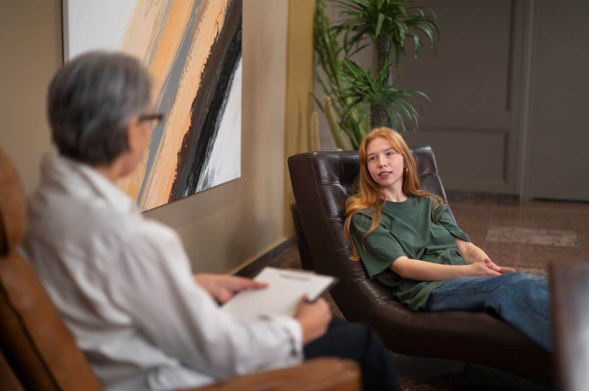 An autism support group giving each other a high-five in a cheerful community setting in Maryland