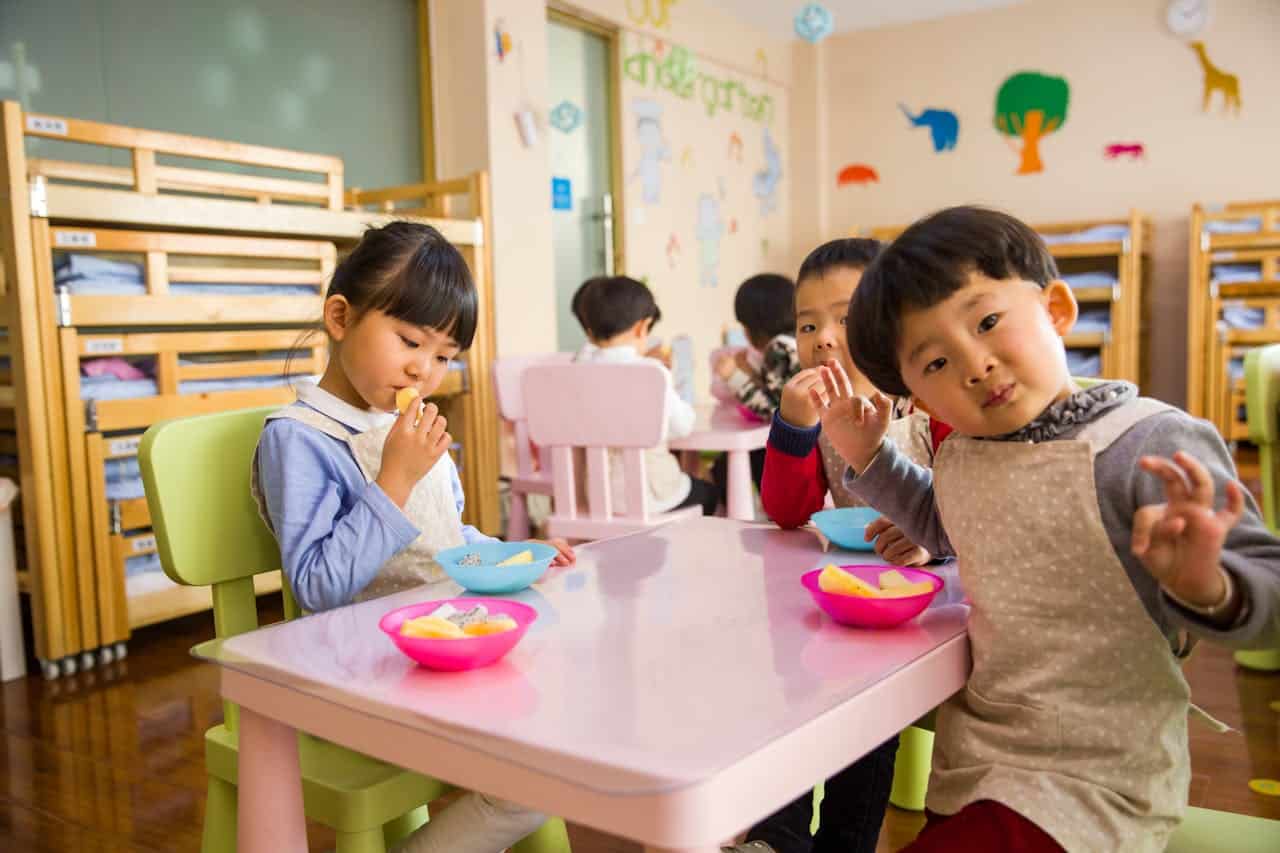 Children eating lunch in classroom