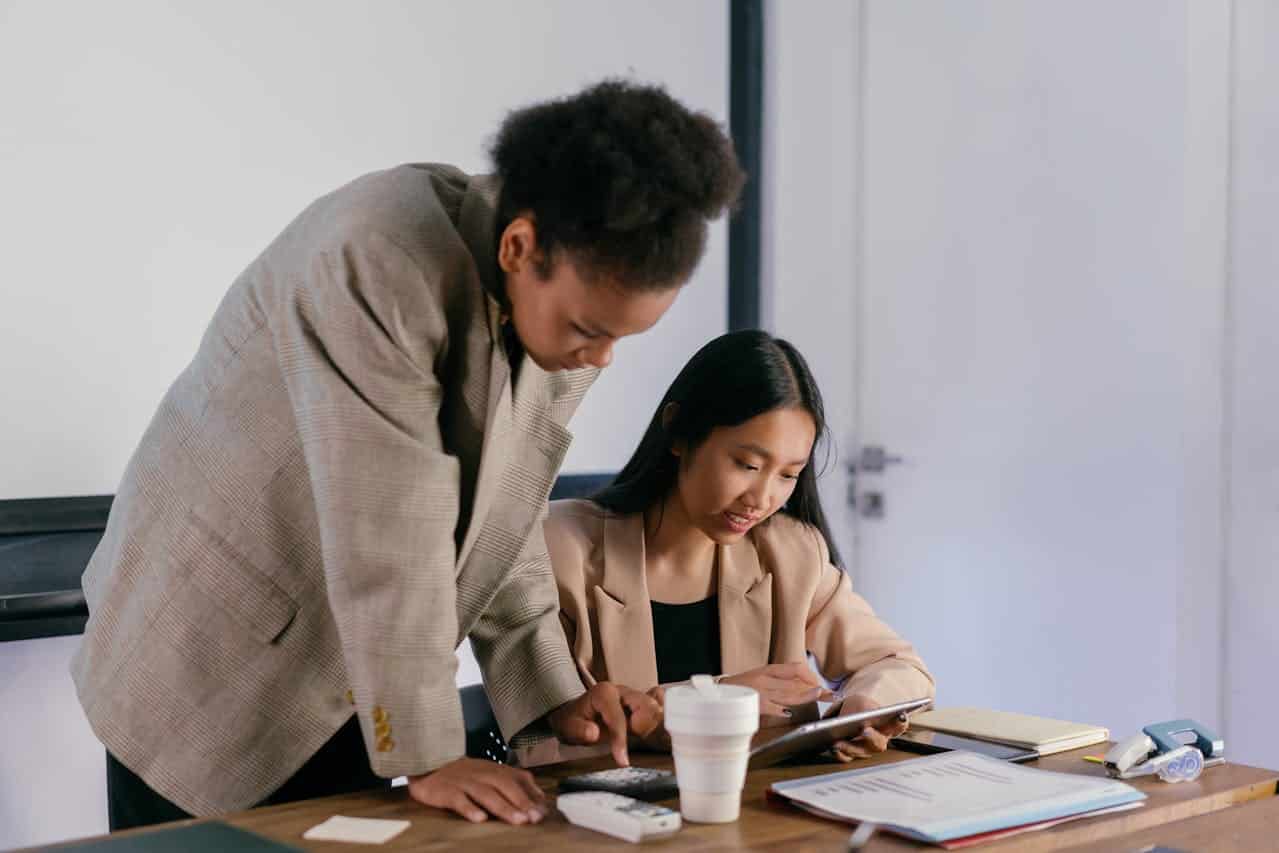 aba therapist working with coworker for what the therapy plan is