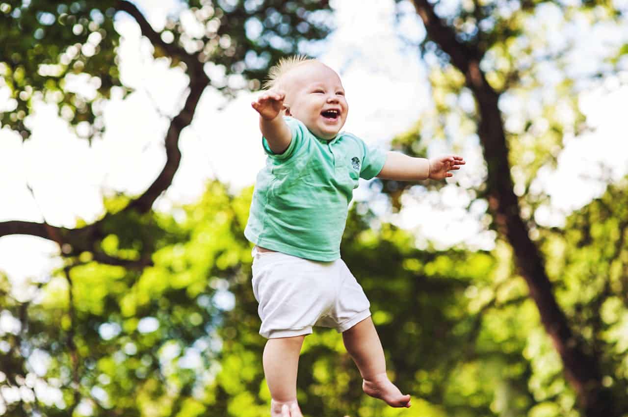 autistic baby laughing in the air