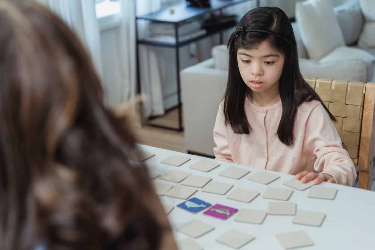 autistic girl playing one of the aba therapy games