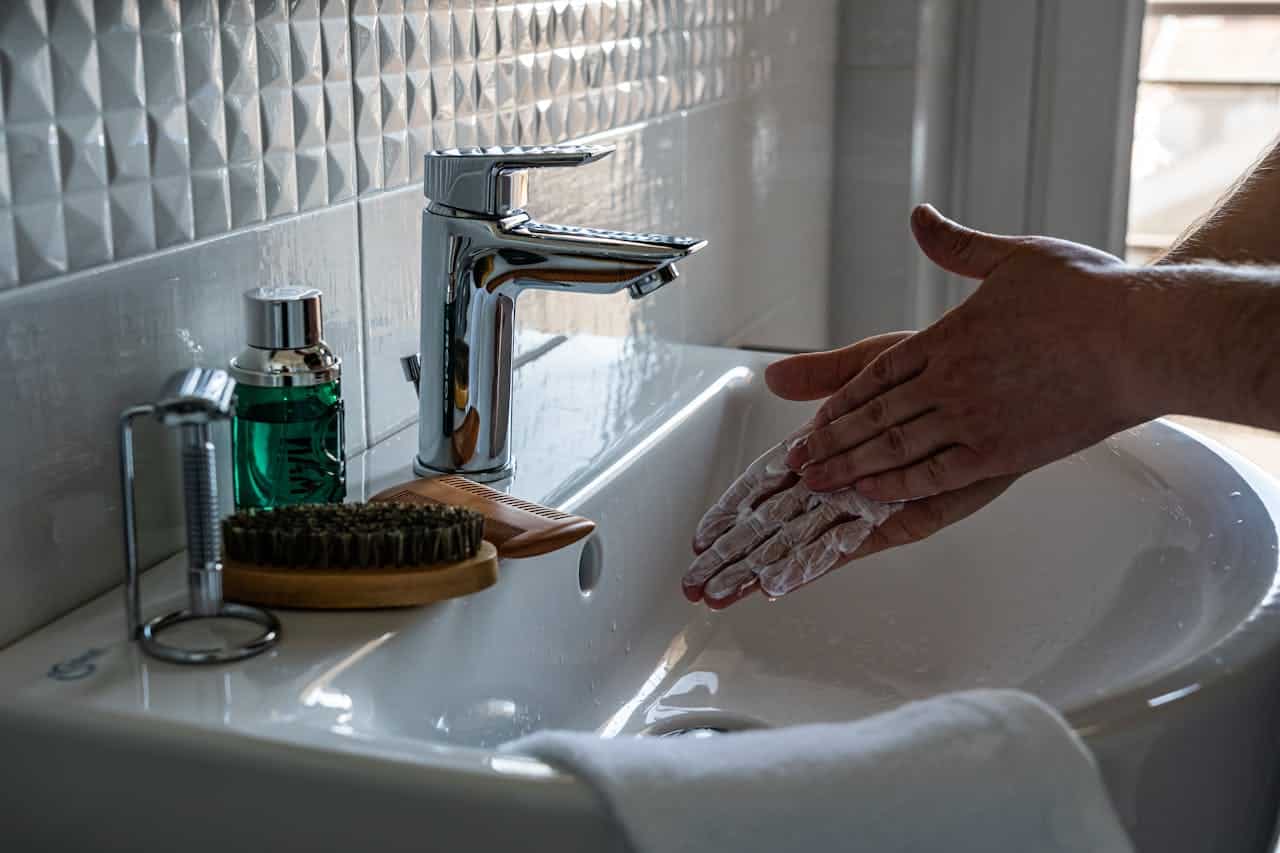 autistic teen washing his hands