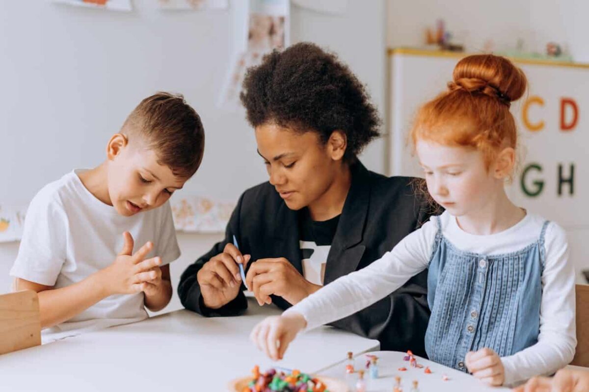 Autistic girl decorating pumpkins as a behavioral therapy, an effective autism and ADHD medication.