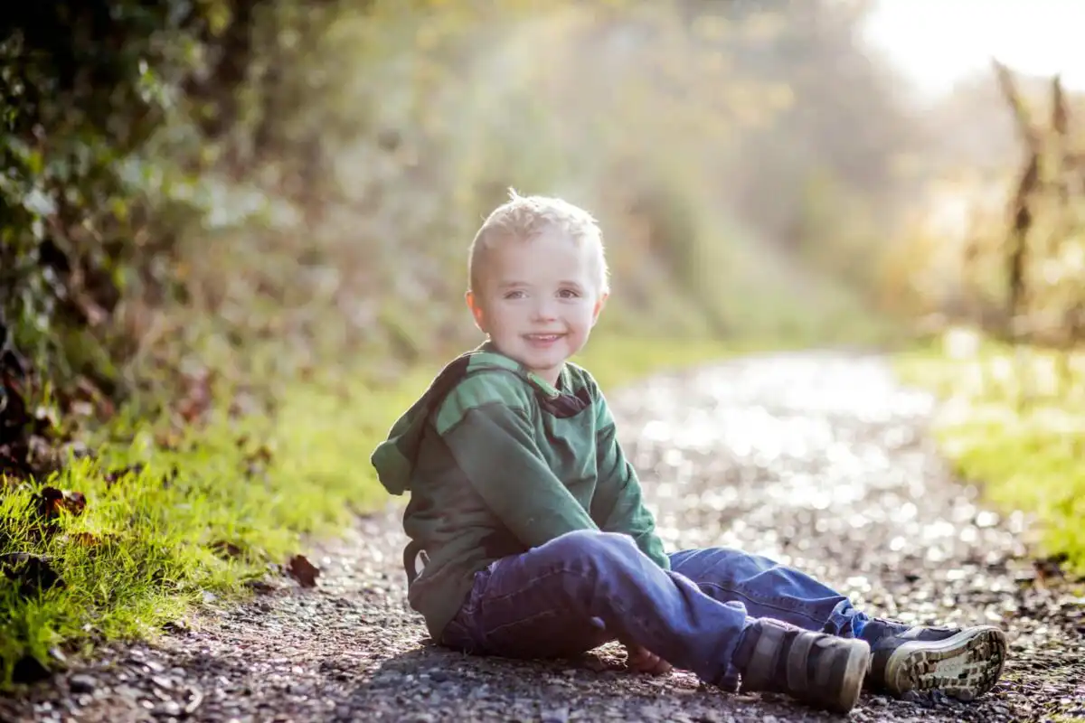 happy boy on the ground for aba therapy and social skills
