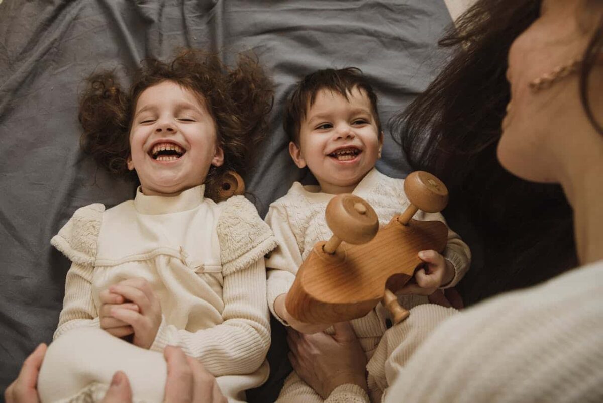 An autism support group giving each other a high-five in a cheerful community setting in Maryland