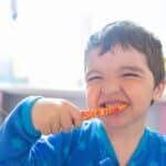 kid brushing his teeth for aba therapy activities