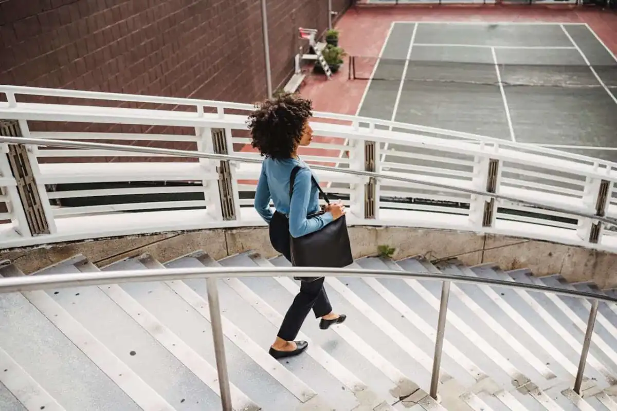 A bcba certified woman, walking.
