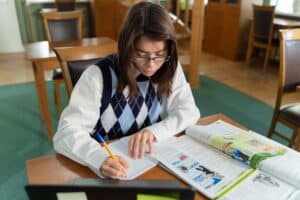 A woman studying for BCBA certification exam