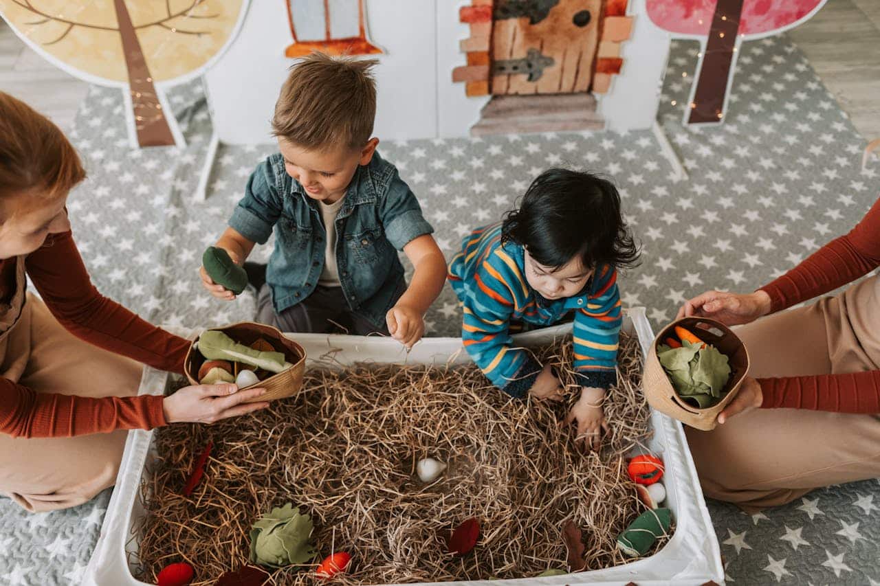 ABA therapist doing gardening exercise with kids