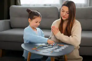 ABA therapy autism support with lady and a child