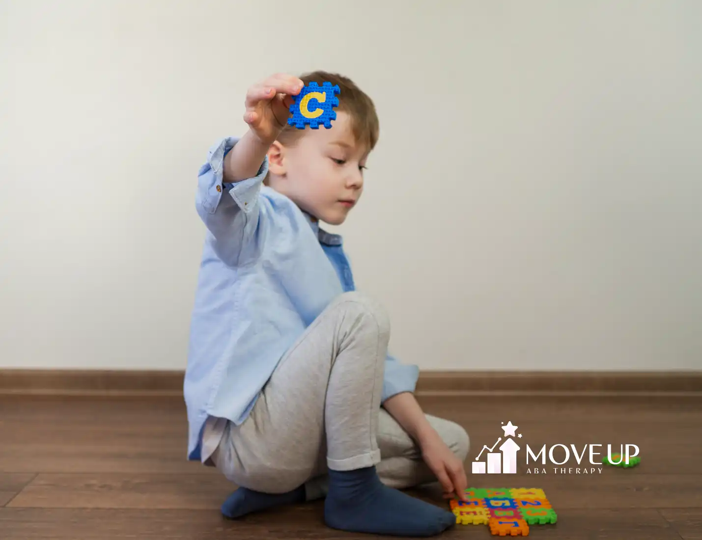 A kid with autism and ADHD playing with colorful puzzles