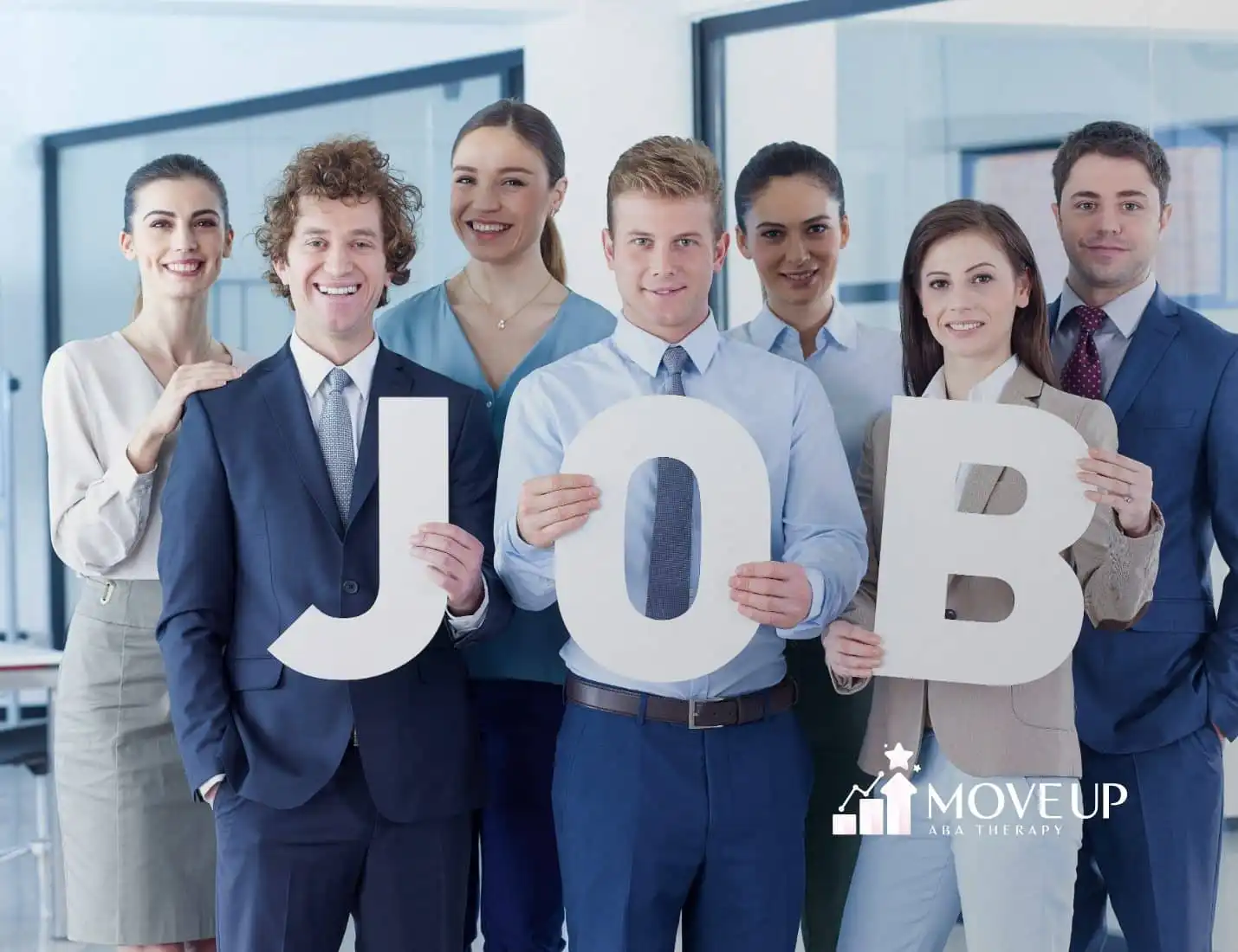 A group of people holding letters spelled JOB