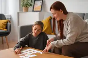Understanding Autism girl playing with her mother