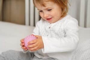 Young child playing sensory ball for spd testing