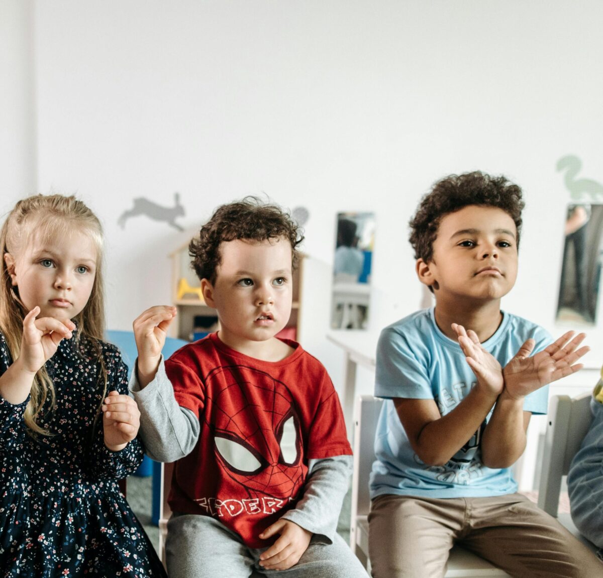 Image of a parent and therapist working together with a toddler during home-based ABA therapy for school readiness.