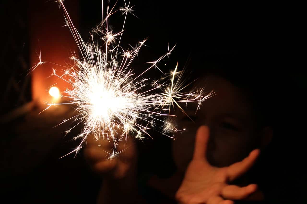 autistic kid with a sparkler in the dark