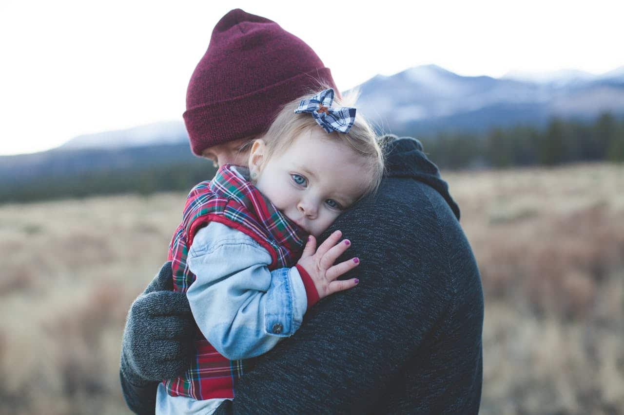 dad comforting his autistic daughter