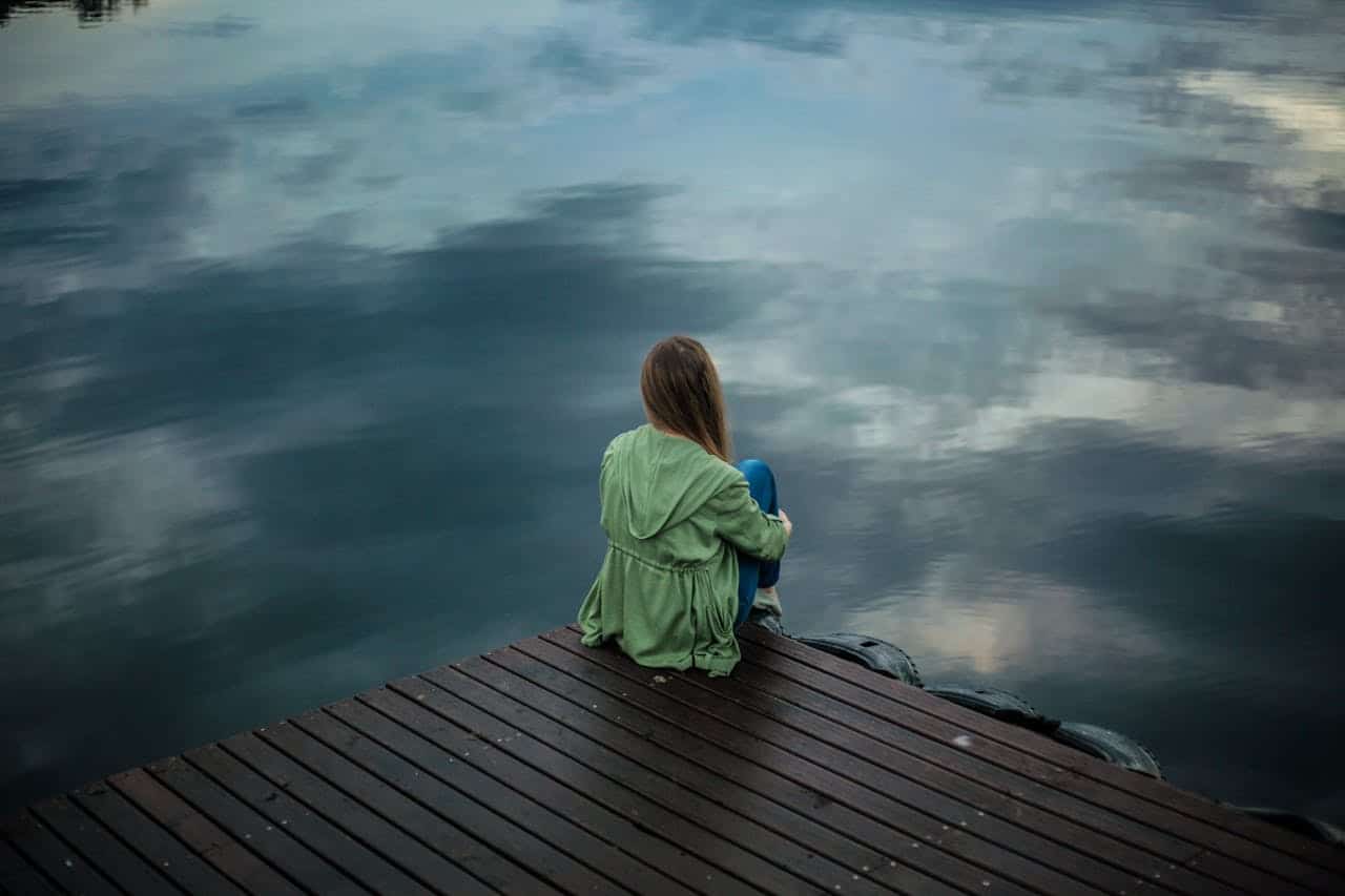 girl on dock by the lake for aba therapy and anxiety