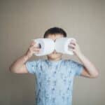 kid with two toilet papers for ABA therapy and potty training