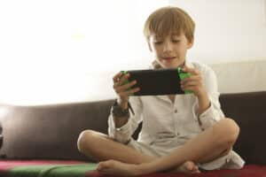 nintendo switch games for kids a boy playing nintendo