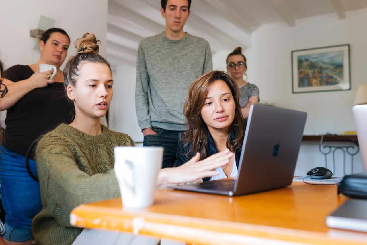 support group for autism hovering around a laptop