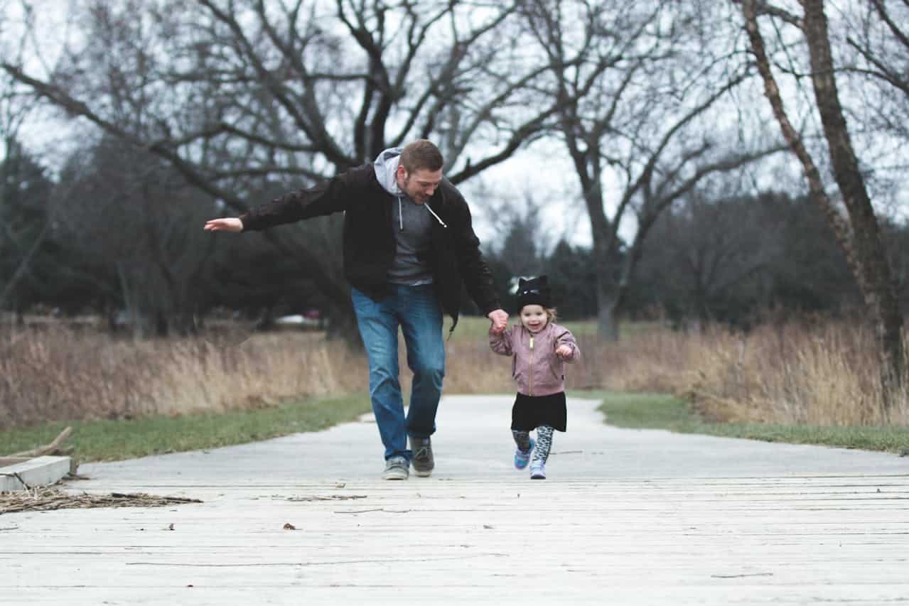 dad and daughter taking a stroll in the park