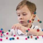 A child with autism playing with toys