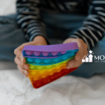 A child with autism playing with a fidget toy