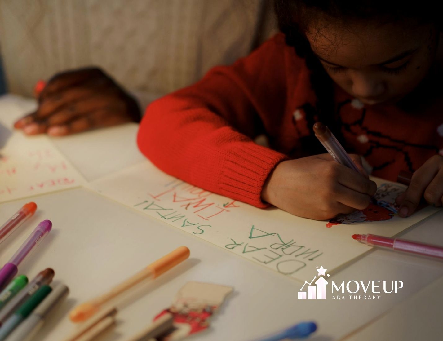 Image of a parent and therapist working together with a toddler during home-based ABA therapy for school readiness.