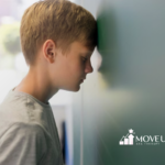 A child with his head against he wall